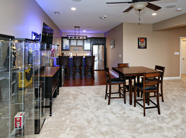 Basement Remodel in Lousiville with New Kitchen, Refrigerator, and Three Bar Stools